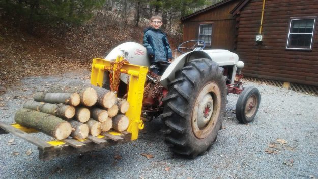 Isaiah helping to bring in the firewood